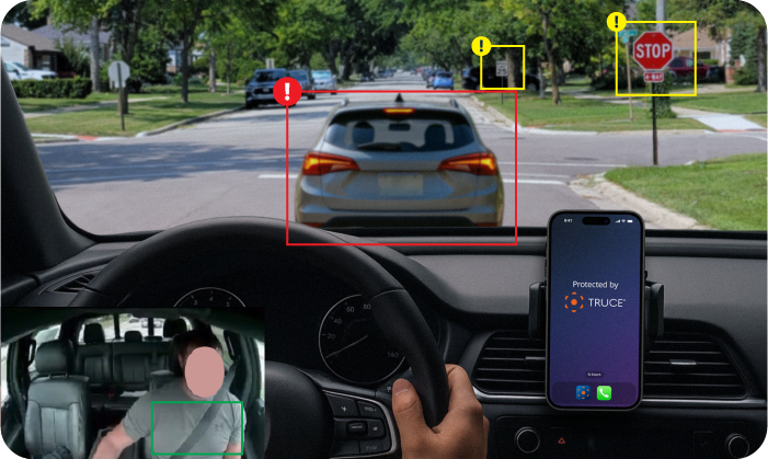 Driver's view with smartphone navigation and alerts.